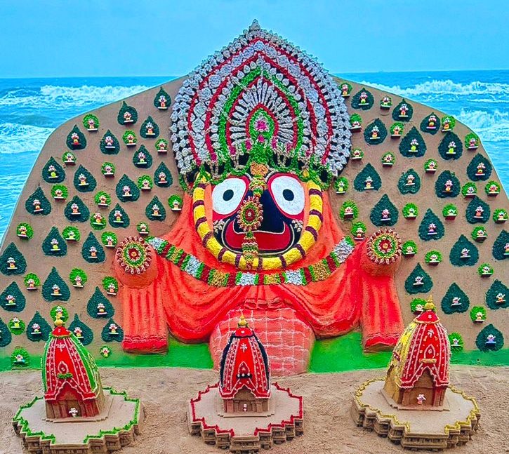 Renowned sand artist Sudarsan Pattnaik creates a Sand Art with 101 idols of Lord Jagannath on Puri beach, Odisha