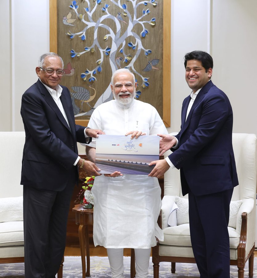 PM Narendramodi meets Venu Srinivasan and Sudarshan Venu of TVS Motor Company